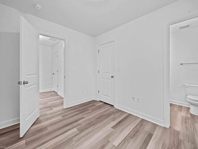 921 Baltic Ave, Virginia Beach, VA 23451 - unfurnished bedroom featuring light wood-style floors and baseboards