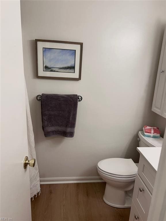 1417 Northface Ct, Virginia Beach, VA 23462 - bathroom featuring wood finished floors, vanity, toilet, and baseboards