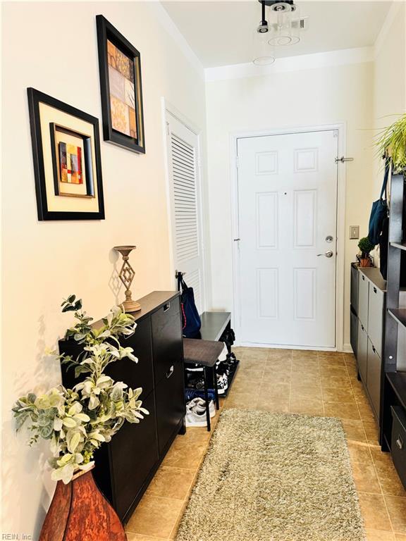 5201 Nuthall Dr Unit 204, Virginia Beach, VA 23455 - foyer featuring light tile patterned floors and ornamental molding