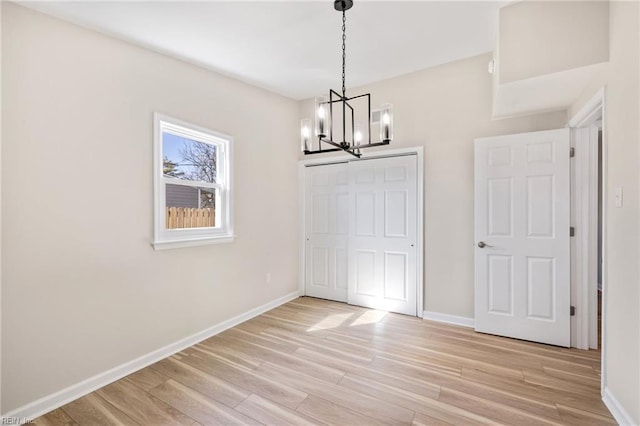 1857 Karen Ln, Virginia Beach, VA 23454 - unfurnished dining area with a chandelier, light wood finished floors, and baseboards