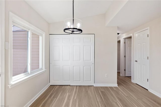 1857 Karen Ln, Virginia Beach, VA 23454 - unfurnished dining area with a chandelier, baseboards, and light wood-type flooring