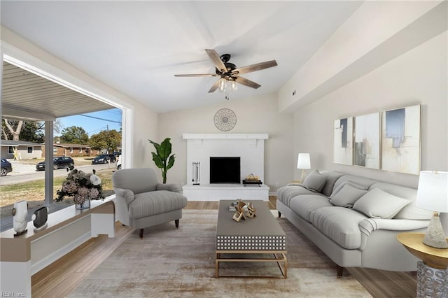 1857 Karen Ln, Virginia Beach, VA 23454 - living area with wood finished floors, a ceiling fan, a fireplace with raised hearth, and vaulted ceiling