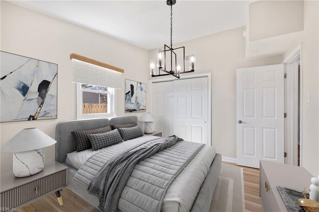 1857 Karen Ln, Virginia Beach, VA 23454 - bedroom with light wood finished floors, a chandelier, and a closet