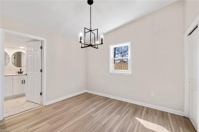 1857 Karen Ln, Virginia Beach, VA 23454 - unfurnished dining area featuring a chandelier, a sink, light wood-style flooring, and baseboards