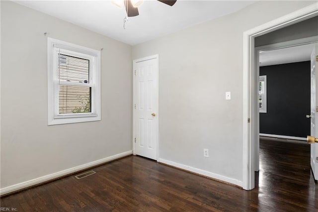14 N Walker Rd, Hampton, VA 23666 - unfurnished bedroom featuring dark wood-style flooring, baseboards, and ceiling fan