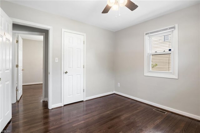 14 N Walker Rd, Hampton, VA 23666 - unfurnished bedroom with dark wood-style floors, baseboards, and a ceiling fan