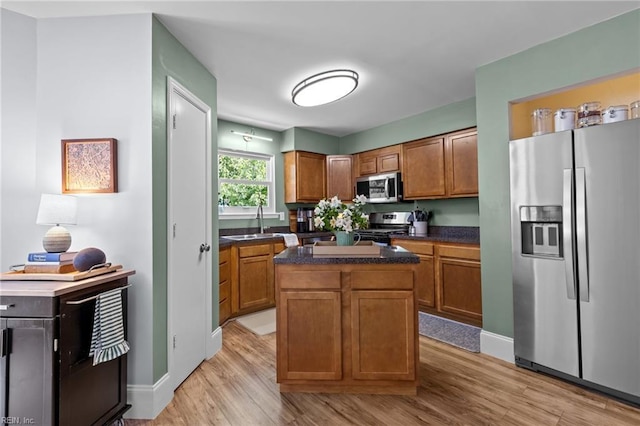 1216 New Born Ct, Chesapeake, VA 23322 - kitchen featuring stainless steel appliances, light wood-style flooring, and brown cabinets
