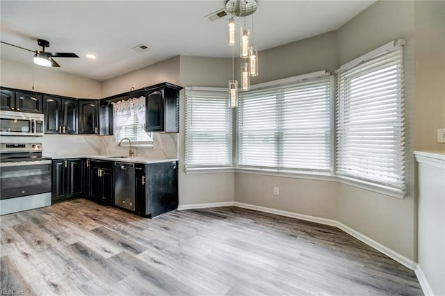32 Gunter Ct, Hampton, VA 23666 - kitchen with stainless steel appliances, ceiling fan, dark cabinetry, light wood-style floors, and recessed lighting