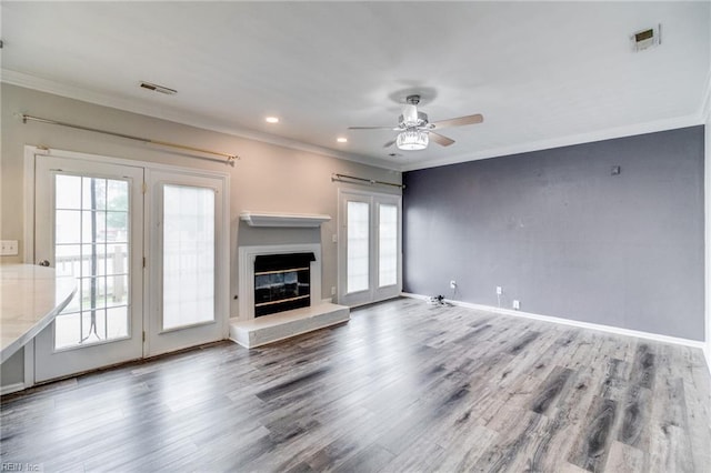 32 Gunter Ct, Hampton, VA 23666 - unfurnished living room featuring ceiling fan, crown molding, wood finished floors, a glass covered fireplace, and recessed lighting