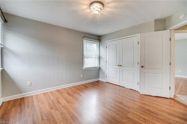 32 Gunter Ct, Hampton, VA 23666 - unfurnished bedroom with light wood-style floors, baseboards, and a closet