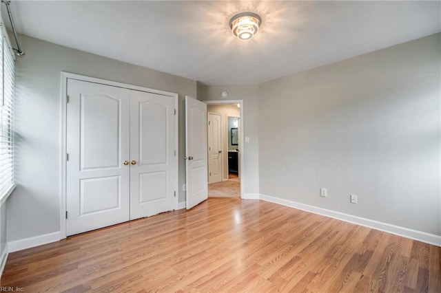 32 Gunter Ct, Hampton, VA 23666 - unfurnished bedroom featuring baseboards, light wood finished floors, and a closet