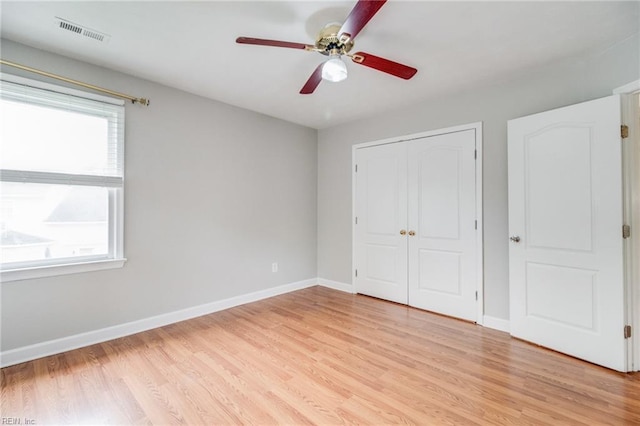 32 Gunter Ct, Hampton, VA 23666 - unfurnished bedroom with multiple windows, light wood-style flooring, baseboards, and a closet
