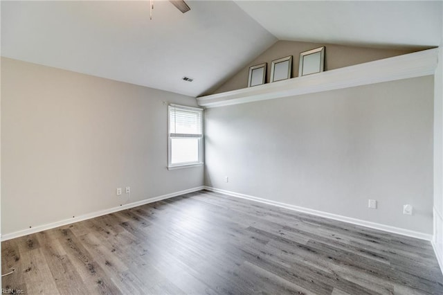 32 Gunter Ct, Hampton, VA 23666 - spare room with vaulted ceiling, wood finished floors, and baseboards