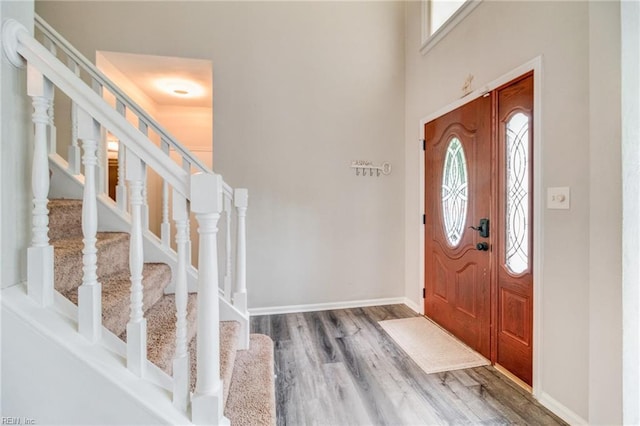 32 Gunter Ct, Hampton, VA 23666 - foyer entrance featuring healthy amount of natural light, wood finished floors, stairs, and baseboards