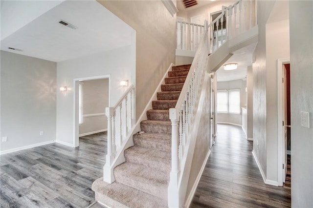 32 Gunter Ct, Hampton, VA 23666 - stairway featuring wood finished floors, baseboards, and a high ceiling