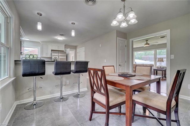 116 Odd Rd, Poquoson, VA 23662 - dining area with baseboards, ceiling fan, and a chandelier