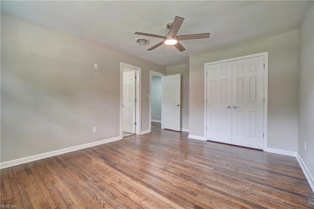 116 Odd Rd, Poquoson, VA 23662 - unfurnished bedroom with baseboards, wood finished floors, a closet, and ceiling fan