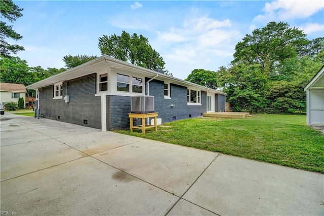 116 Odd Rd, Poquoson, VA 23662 - back of property with crawl space, a yard, and brick siding