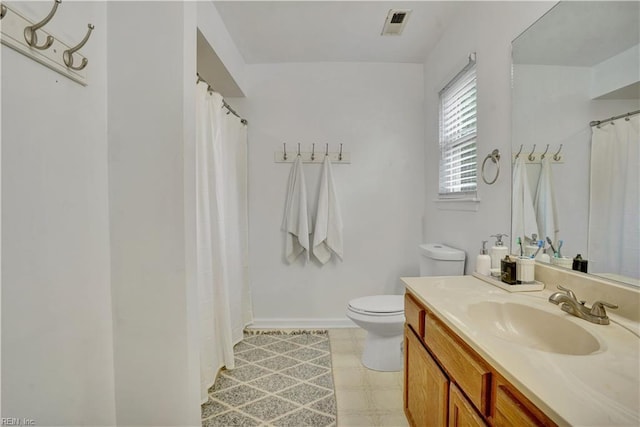 1240 Mozart Dr, Virginia Beach, VA 23454 - full bathroom featuring toilet, vanity, tile patterned floors, baseboards, and a shower with shower curtain