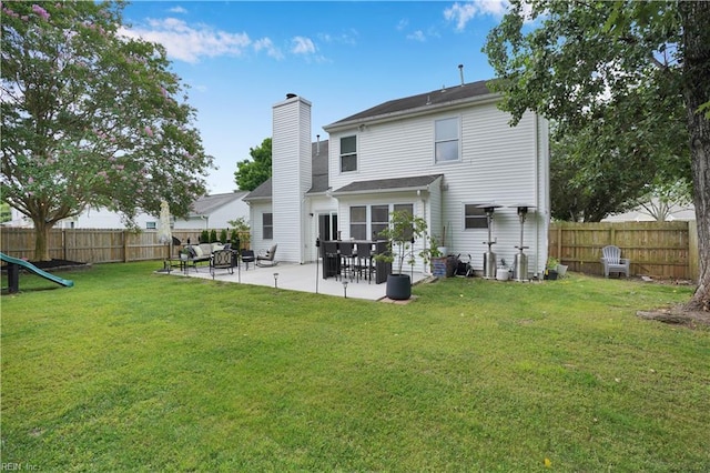 1240 Mozart Dr, Virginia Beach, VA 23454 - rear view of property with a chimney and a patio