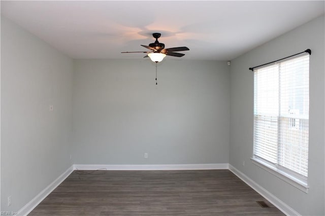 1158 Virginia Ave, Chesapeake, VA 23324 - spare room featuring a ceiling fan, plenty of natural light, dark wood-style floors, and baseboards