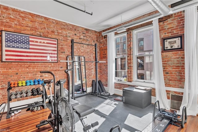 111 W Tazewell St Unit 200, Norfolk, VA 23510 - exercise area with brick wall and wood finished floors