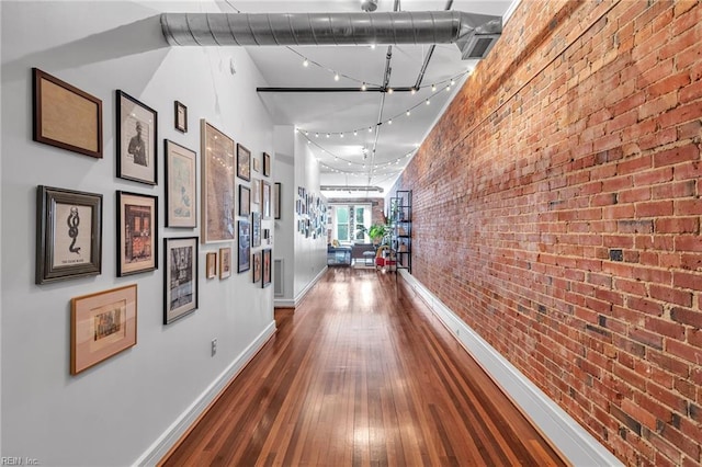 111 W Tazewell St Unit 200, Norfolk, VA 23510 - corridor with brick wall, hardwood / wood-style floors, and baseboards