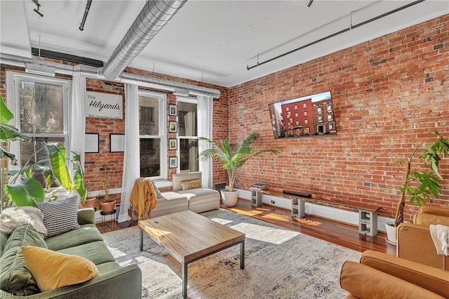 111 W Tazewell St Unit 200, Norfolk, VA 23510 - living room featuring wood finished floors and brick wall