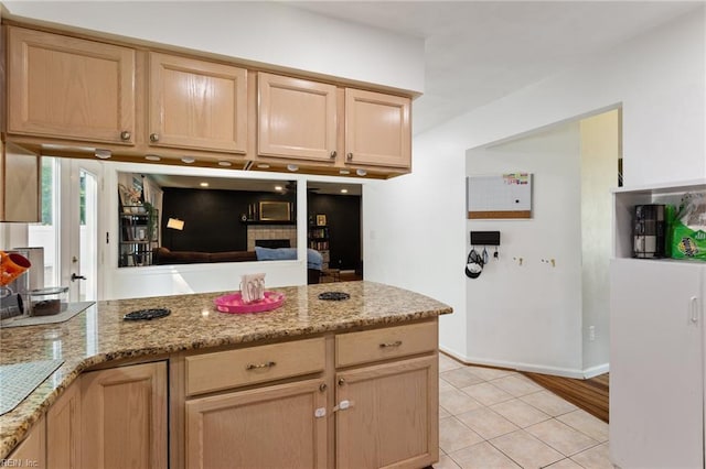 2389 Kerr Dr, Virginia Beach, VA 23454 - kitchen featuring light brown cabinetry, light tile patterned flooring, light stone countertops, and baseboards