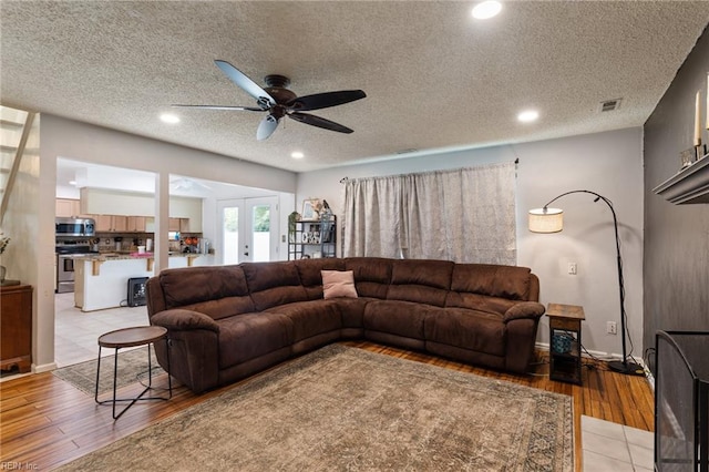 2389 Kerr Dr, Virginia Beach, VA 23454 - living area with a ceiling fan, french doors, light wood-type flooring, recessed lighting, and a textured ceiling