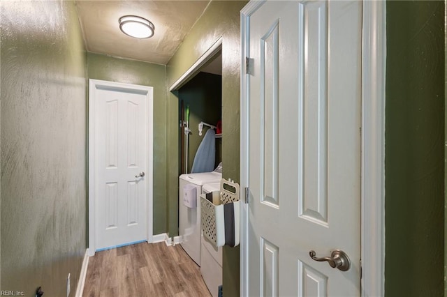 2389 Kerr Dr, Virginia Beach, VA 23454 - laundry area with washer and clothes dryer, wood finished floors, and baseboards