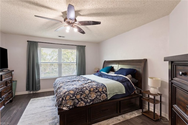 2389 Kerr Dr, Virginia Beach, VA 23454 - bedroom featuring a textured ceiling, dark wood-type flooring, a ceiling fan, and baseboards
