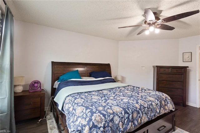 2389 Kerr Dr, Virginia Beach, VA 23454 - bedroom featuring dark wood-type flooring, a ceiling fan, a textured ceiling, and baseboards