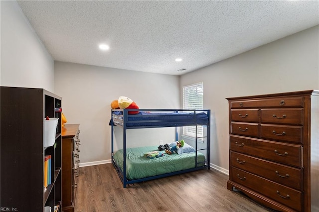2389 Kerr Dr, Virginia Beach, VA 23454 - bedroom with dark wood-style floors, a textured ceiling, baseboards, and recessed lighting