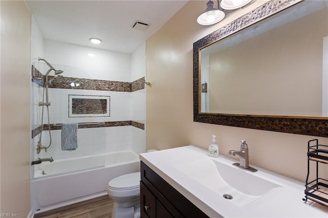 2389 Kerr Dr, Virginia Beach, VA 23454 - bathroom featuring toilet, vanity, shower / bath combination, and wood finished floors