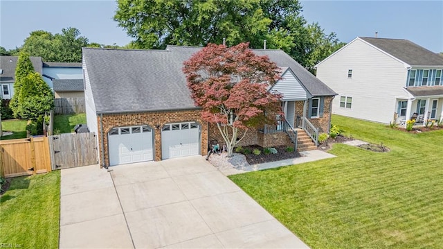1213 Mozart Dr, Virginia Beach, VA 23454 - view of front facade with brick siding, a gate, driveway, and a garage