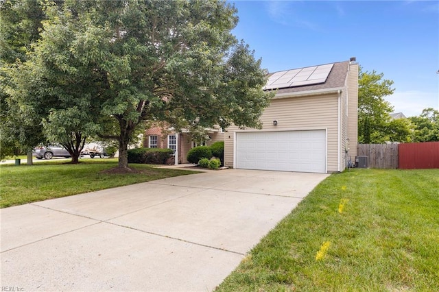 6 Elite Ct, Hampton, VA 23666 - view of property hidden behind natural elements featuring roof mounted solar panels, a chimney, driveway, central air condition unit, and a garage