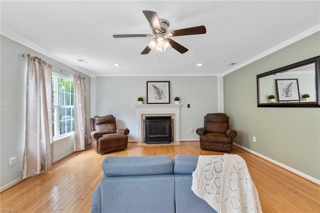 6 Elite Ct, Hampton, VA 23666 - living area featuring light wood-type flooring, a fireplace with flush hearth, a ceiling fan, baseboards, and ornamental molding