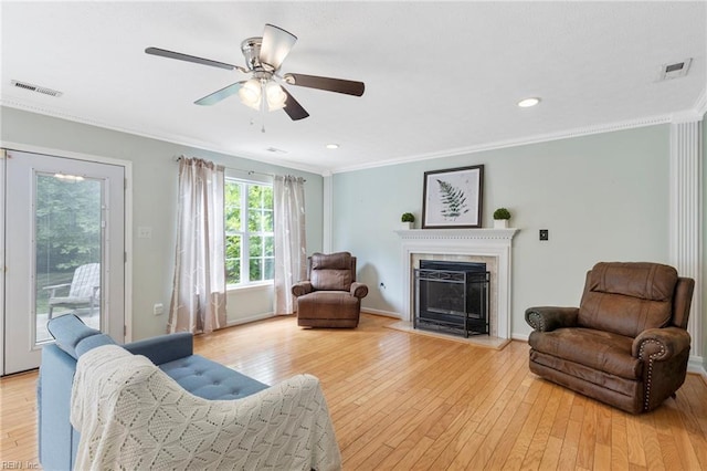 6 Elite Ct, Hampton, VA 23666 - living area featuring light wood-style floors, ornamental molding, a fireplace with raised hearth, ceiling fan, and recessed lighting