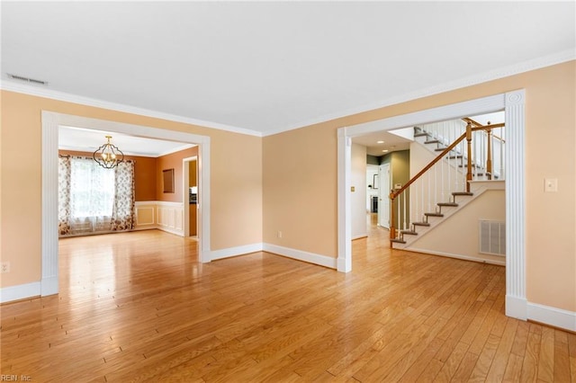 6 Elite Ct, Hampton, VA 23666 - unfurnished living room featuring light wood-style floors, stairs, ornamental molding, a chandelier, and baseboards
