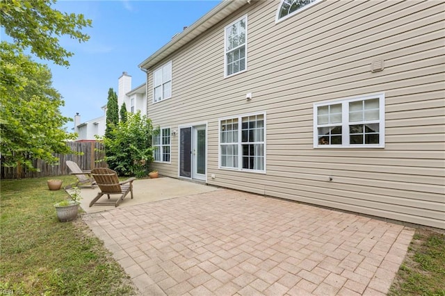 6 Elite Ct, Hampton, VA 23666 - back of property with a patio area and a chimney