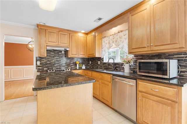 6 Elite Ct, Hampton, VA 23666 - kitchen featuring stainless steel appliances, dark stone countertops, a center island, under cabinet range hood, and ornamental molding