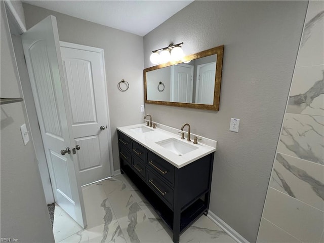 420 Webb St, Suffolk, VA 23434 - full bathroom with marble finish floors, double vanity, and baseboards