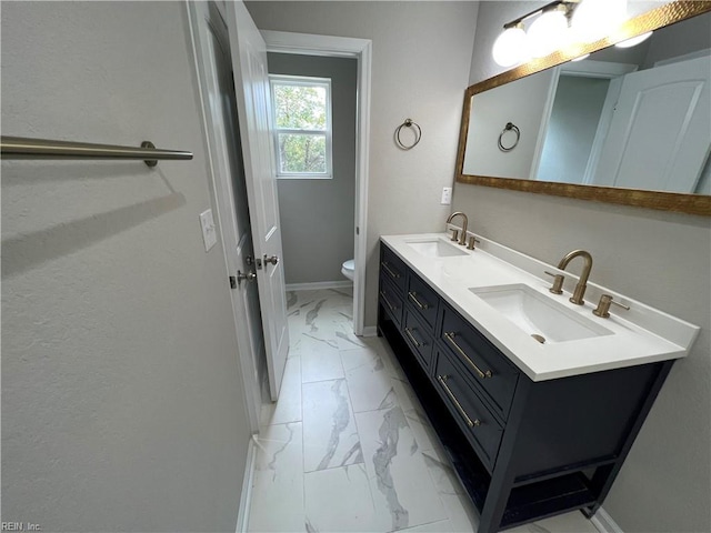 420 Webb St, Suffolk, VA 23434 - bathroom with marble finish floors, double vanity, baseboards, and toilet