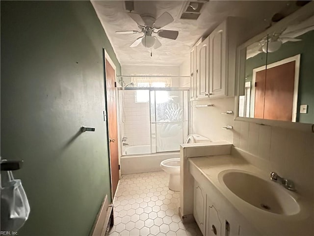 1649 Cardigan St, Chesapeake, VA 23324 - bathroom with toilet, vanity, shower / bath combination with glass door, a ceiling fan, and tile patterned flooring