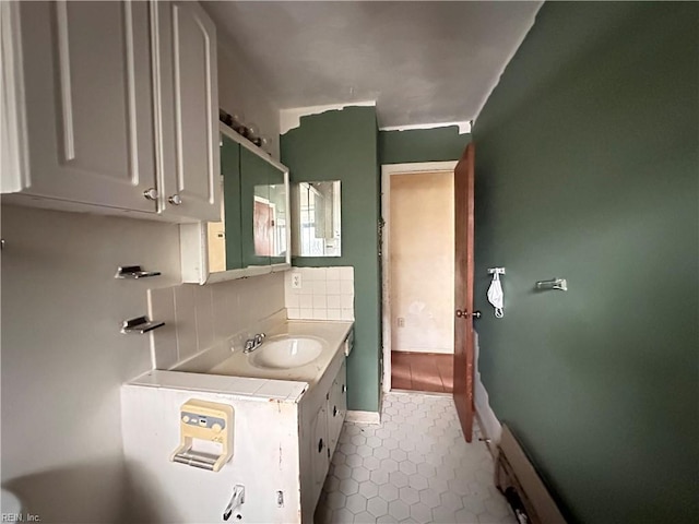 1649 Cardigan St, Chesapeake, VA 23324 - bathroom featuring tile patterned flooring, vanity, tasteful backsplash, and baseboards