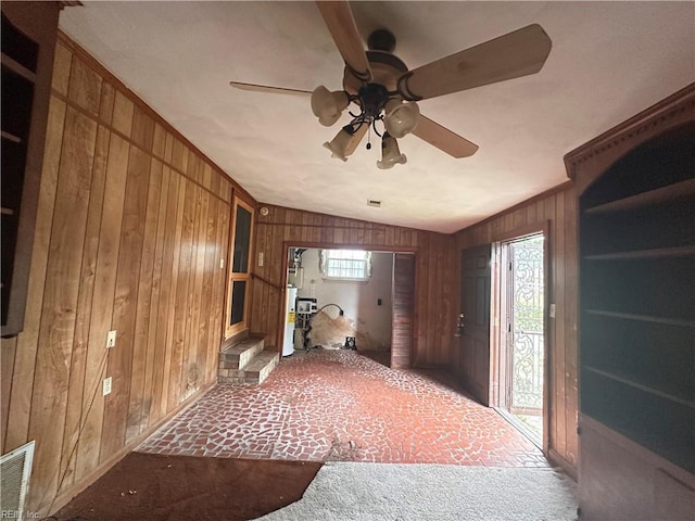 1649 Cardigan St, Chesapeake, VA 23324 - entryway with carpet, wood walls, ceiling fan, and healthy amount of natural light