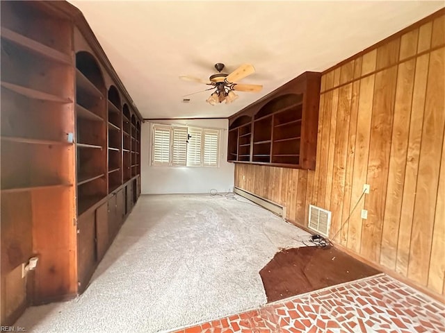 1649 Cardigan St, Chesapeake, VA 23324 - spare room featuring wooden walls, baseboard heating, ceiling fan, and carpet flooring