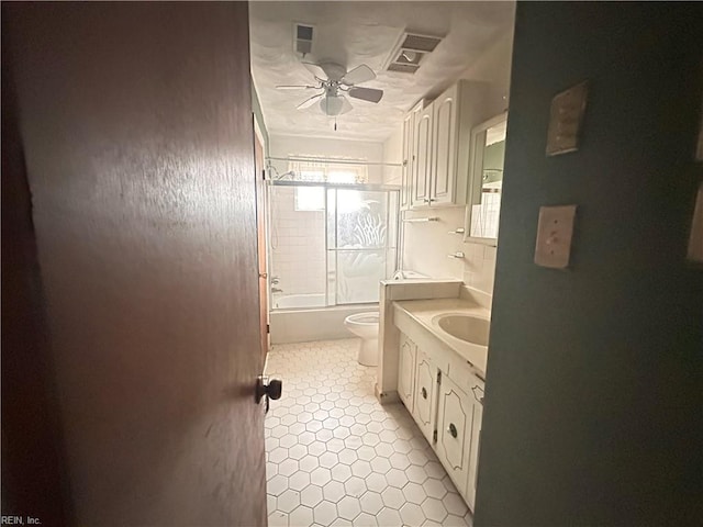 1649 Cardigan St, Chesapeake, VA 23324 - bathroom with vanity, toilet, a ceiling fan, tile patterned floors, and shower / tub combination