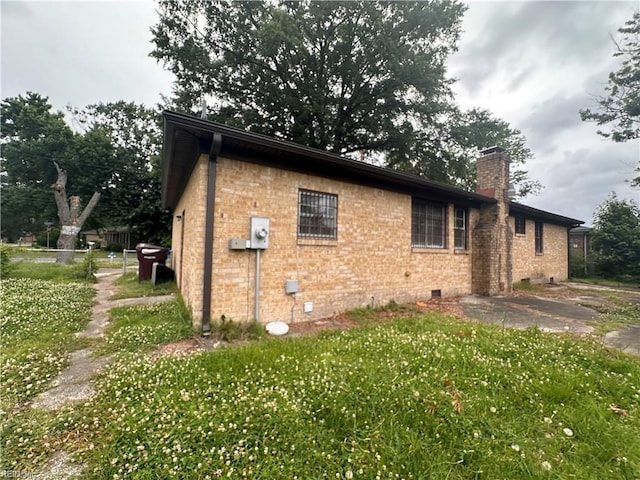 1649 Cardigan St, Chesapeake, VA 23324 - view of property exterior featuring crawl space, a chimney, and brick siding